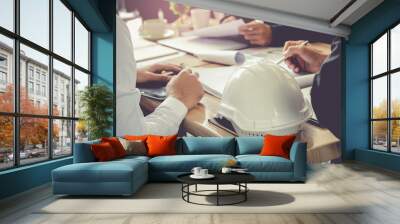 architect and businessman planning meeting to work with commitment, set mind.focus white safety helm Wall mural