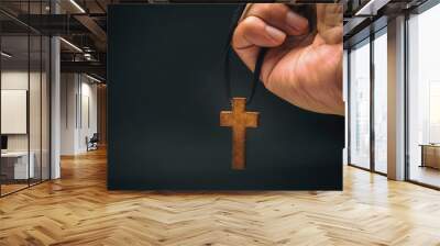 The crucifix is in the hands of a man who is praying for the blessing of his god with faith. Wall mural