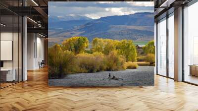 Anglers floating a Montana river and fishing in the fall in Montana and fly fishing from a drift boat Wall mural