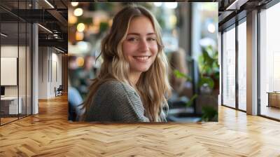 a young woman works on his laptop, in a co working space Wall mural