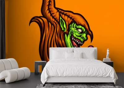 vector illustration of creepy green goblin head with a candy on the orange background. hand-drawn il Wall mural