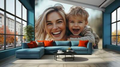 Happy beautiful young mother is playing with her little son while he is riding on her back and shouting for joy, Generative AI Wall mural