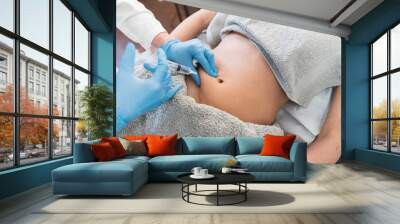 Woman's having lipolysis treatment Wall mural