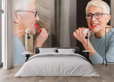 woman brushing her teeth Wall mural