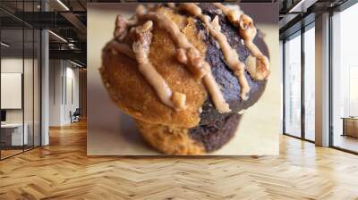 white chocolate chip muffin and liquid caramel wrapped in paper Wall mural