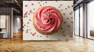 An upbeat cupcake with lively pink icing against a bright white backdrop in an overhead perspective Wall mural