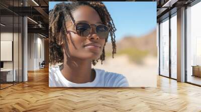 Black woman on a road trip, enjoying desert views, travel adventure lifestyle Wall mural