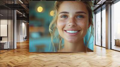 a young woman checks her smile after teeth cleaning, braces, and dental consultation. Healthcare, dentistry, and a happy female patient for oral hygiene, wellness, and cleaning  Wall mural