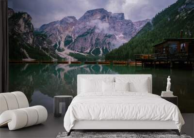 Beautiful landscape of Braies Lake Lago di Braies, romantic place with wooden bridge and boats on the alpine lake, Alps Mountains, Dolomites, Italy, Europe Wall mural