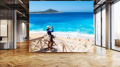 Kaputas beach Lycia coast Turkey Kaputas Beach, young Asian women looking out over the Mediterranean Sea on a sunny day, Kas, Turkey. Wall mural