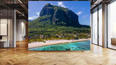 Le Morne beach Mauritius Tropical beach with palm trees and white sand blue ocean and beach beds with umbrellas, sun chairs, and parasols under a palm tree at a tropical beach. Mauritius Le Morne Wall mural