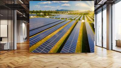 Sun power solar panel field in Thailand in the evening light during sunset. Sun energy green energy transition in Thailand Wall mural