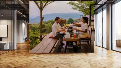 Thai Barbecue Buffet in the mountains on a tented camp, Thai style Grilled Sliced pork Thai Barbeque. couple having dinner outside Wall mural