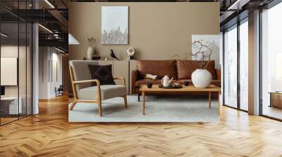 Interior design of cozy living room interior with mock up poster frame, brown sofa, gray armchair, wooden coffee table, beige carpet and personal accessories. Home decor. Template. Wall mural