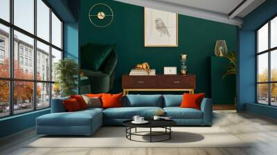 Luxury interior with stylish velvet sofa, wooden commode, pouf, plants, carpet, gold decoration, mock up poster frame and elegant personal accessories. Modern living room in classic house. Wall mural