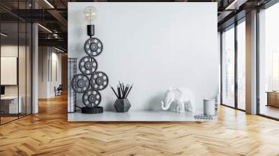 Modern and stylish black and white home decor mock up. Creative desk with blank picture frame or poster, desk objects, office supplies, elephant figure and design table lamp on a white background. Wall mural