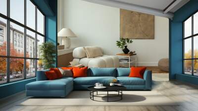 Modern living room interior featuring cozy, plush white sofas a wooden side table with decorative items, and minimalist decor. The space is enhanced by a large abstract painting and a soft rug. Wall mural