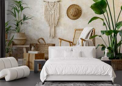 Stylish and floral composition of living room interior with rattan armchair, a lot of tropical plants in design pots, decoration, macrame and elegant personal accessories in cozy home decor. Wall mural