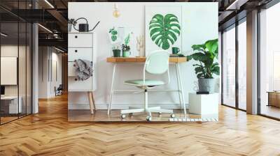 Stylish and modern scandinavian interior of home office desk with mock up poster frames, a lot of plants and office accessories. Modern composition of homeoffice desk. Wall mural