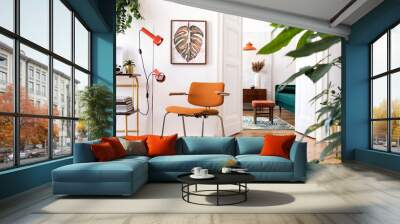 Stylish compositon of retro home interior with mock up poster frame, vintage furnitures, velvet sofa, design lamps, gold shelf, plants and elegant accessories. Nice home decor of living rooms.  Wall mural