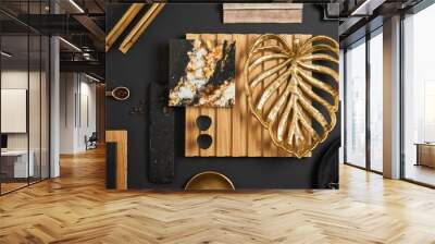 Stylish flat lay comosition of creative architect moodboard with samples of textile, paint, wooden lamella panel and marble tile. Golden, black and beige color palette. Copy space. Template. Wall mural