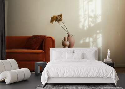 stylish interior of living room at fancy home with design sofa, yellow side table, dried flowers, pi Wall mural