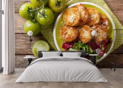 American crispy fried green tomatoes with fresh lettuce close-up on a plate. horizontal top view Wall mural