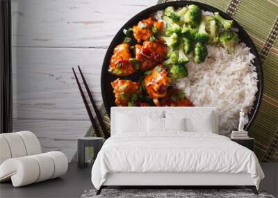 Asian chicken with rice, onions and broccoli. Horizontal top view
 Wall mural