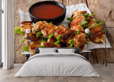 Asian spicy chicken skewered with green onion and chili sauce close-up. horizontal Wall mural