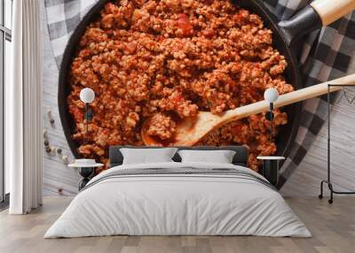 Bolognese sauce in a frying pan close-up horizontal top view Wall mural