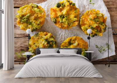 Broccoli bites with cheddar cheese, egg and thyme close-up on the table. Horizontal top view Wall mural