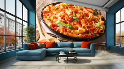 Casserole ziti pasta with minced meat, tomatoes, herbs and cheese close-up on a plate. horizontal Wall mural