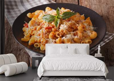 gomiti pasta with tomatoes, beans and parmesan on a plate close-up. Horizontal
 Wall mural