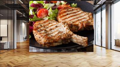 grilled pork steak with bone and fresh salad close-up. horizontal Wall mural