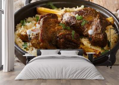 Haneeth is a slow roasted lamb dish from Yemen served on a plate of rice closeup on the table. horizontal Wall mural