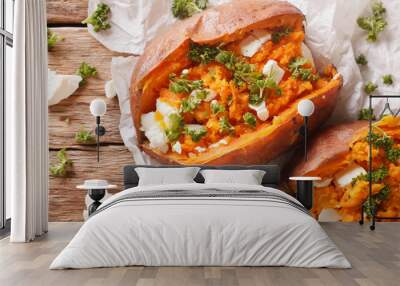 healthy food: baked sweet potato stuffed with cheese and parsley close-up. horizontal top view Wall mural