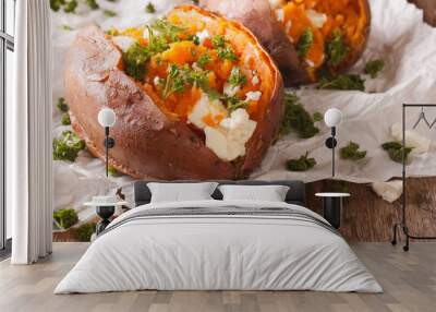 healthy food: baked sweet potato stuffed with cheese and parsley close-up. horizontal Wall mural