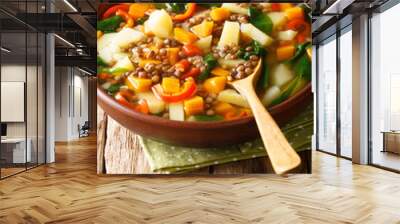 Italian healthy soup with lentils and spinach close-up in a bowl. vertical Wall mural