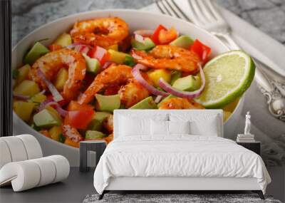 Prawn salad with avocado, mango, red onion, bell pepper and homemade dressing closeup on the bowl on the table. Horizontal Wall mural