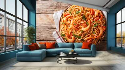 Spicy spaghetti with shrimps in tomato sauce close-up. Horizontal top view from above Wall mural