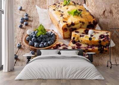 summer loaf of fresh blueberry muffin bread cake decorated with mint closeup. horizontal Wall mural