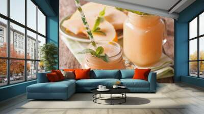 Tasty smoothies of melon with mint macro in a glass jar. horizontal
 Wall mural