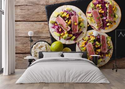 tortilla with tuna steak, sesame and fresh vegetables close-up. Horizontal top view Wall mural