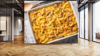 Tuna mornay is a classic Australian cheesy tuna pasta bake closeup on the baking dish on the table. Horizontal top view from above Wall mural