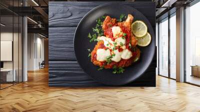 Veal Milanesa Napolitana with mozzarella cheese and tomato sauce close-up on a plate. horizontal top view Wall mural