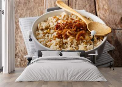 Vegetarian meal: Mujaddara rice with lentils and fried onions close-up in a bowl. horizontal Wall mural