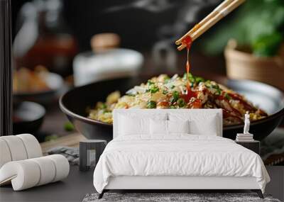 A steaming bowl of Japanese omurice with fried rice, chicken, vegetables, and ketchup. Wall mural