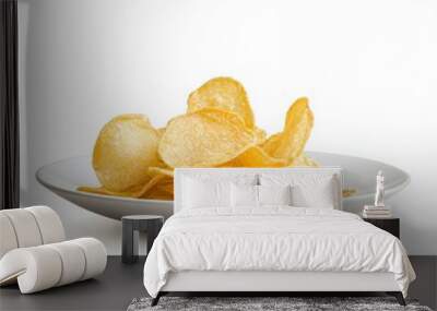 Crisps on a plate, isolated on a white background, elegantly arranged for an enticing snack presentation. Wall mural