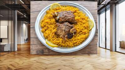 Arabian Kabsa meat rice with lemon slice served in dish top view of middle east food Wall mural