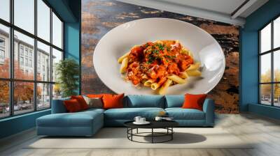 Butter chicken pasta served in a dish isolated on dark background side view food Wall mural